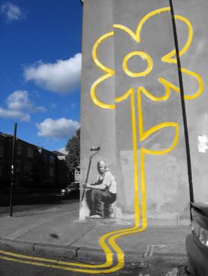 color splash yellow lines on the wall in the shape of a flower blue sky and a painter zag7734 Pictures, Images and Photos